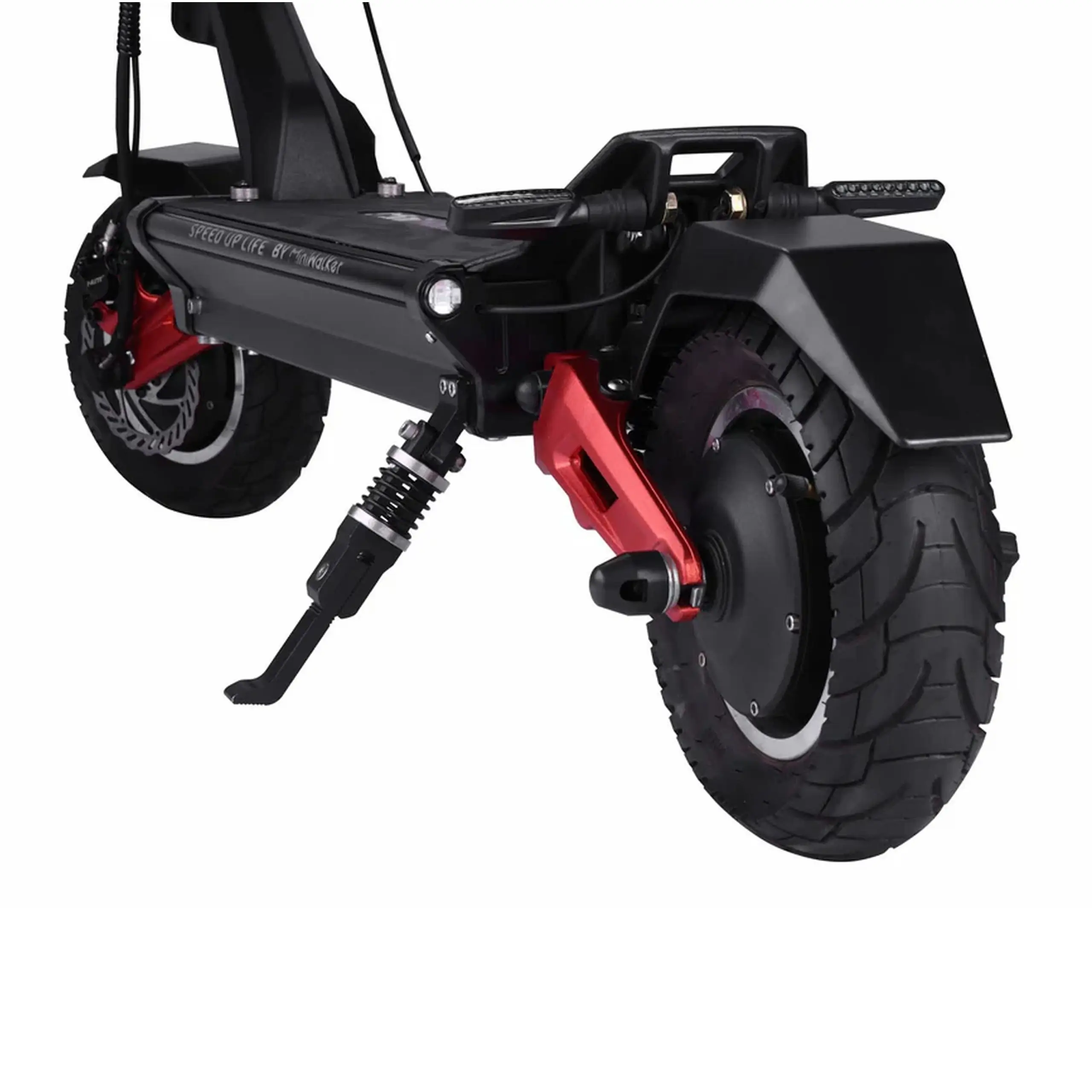Suspension arrière de la MiniWalker Tiger 10 Pro Gros plan sur la roue, la suspension et l’éclairage arrière de la trottinette électrique MiniWalker Tiger 10 Pro noire et rouge.